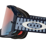Oakley Airbrake goggles with a dark navy blue frame, a light blue and navy patterned strap featuring a white Oakley logo, and a mirrored pink-to-blue lens.
